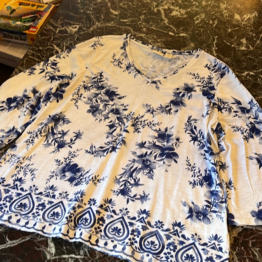 60% cotton 40% Modell, blue and white print bell sleeve  Chico’s